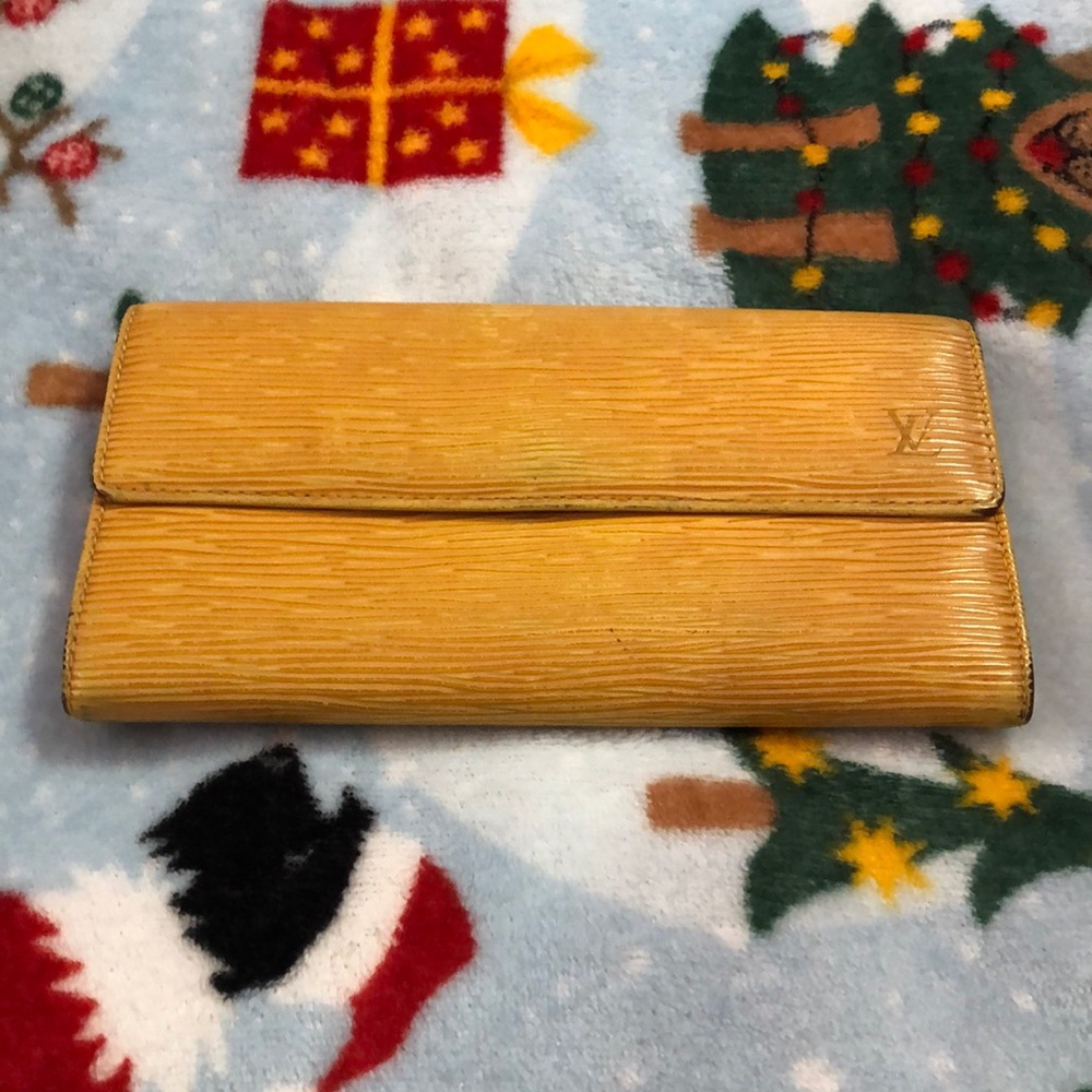 Louis Vuitton Yellow Wallet with Leather Texture and Flap Closure Authenic